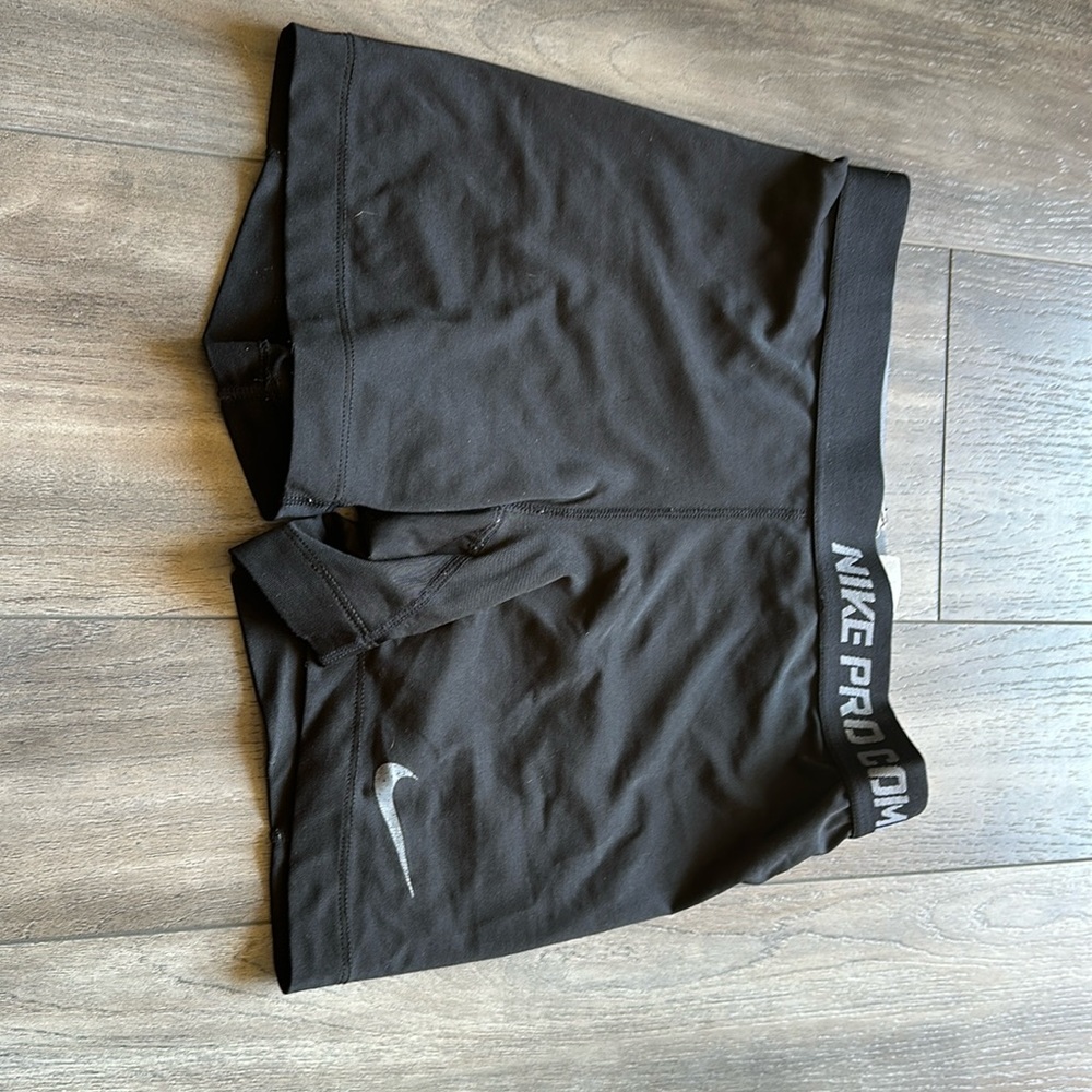 These are older nike pros. They are black and are meant to be tight fitting